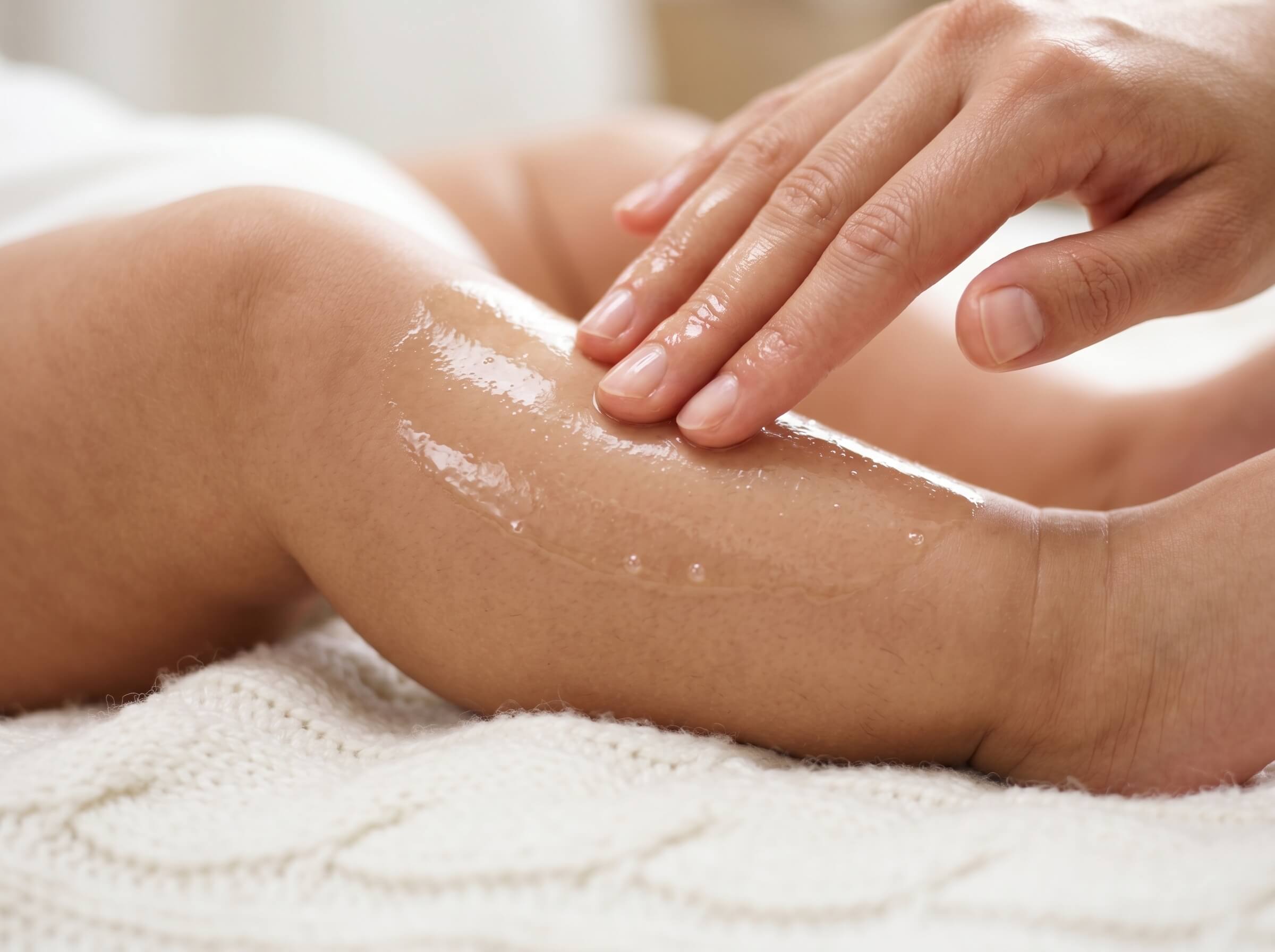 Applying Organic Baby oil on baby's leg