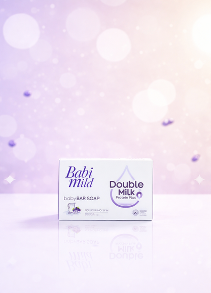 Babi Mild Double Milk baby bar soap packaging on a soft purple background